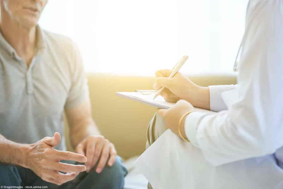 Man talking with doctor, who is taking notes on a clipboard | Image Credit: © DragonImages - stock.adobe.com