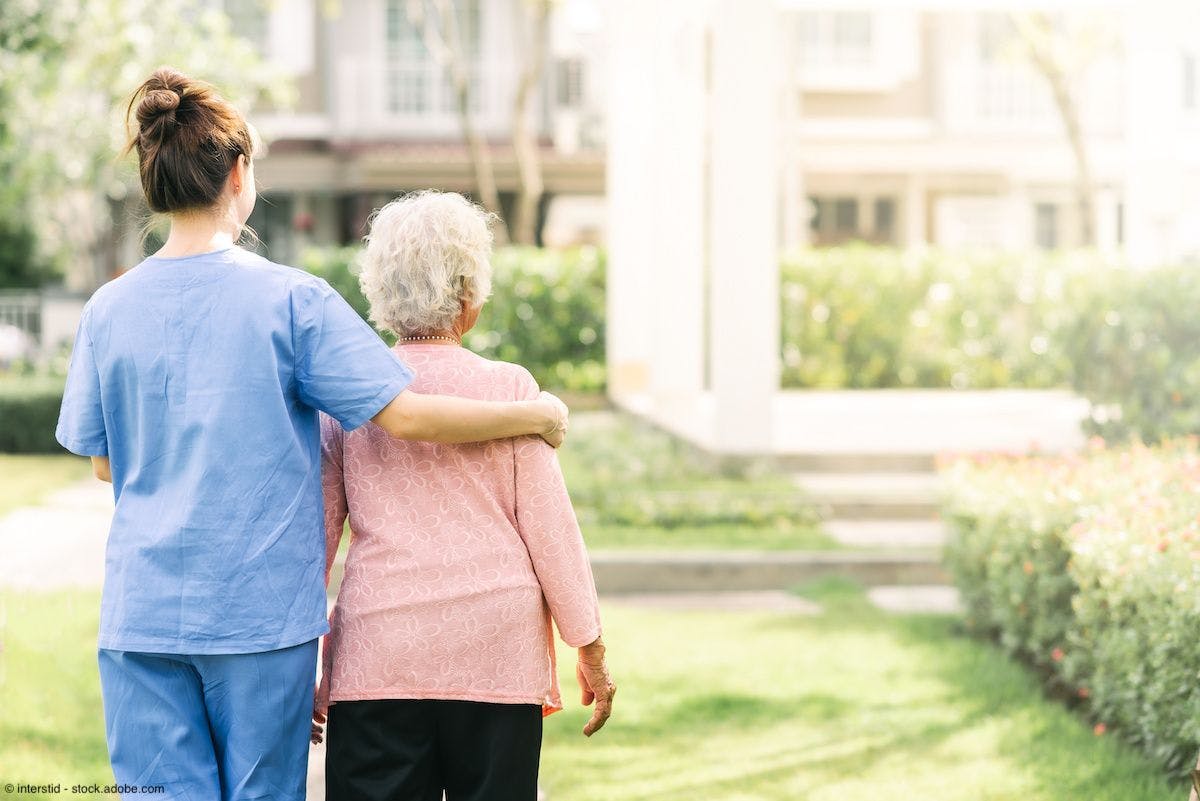 nurse caregiver support walking with elderly woman outdoors | Image Credit: © interstid - stock.adobe.com